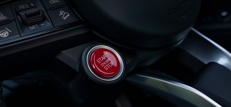 QUADRIFOGLIO-INSPIRED RED ENGINE START BUTTON
