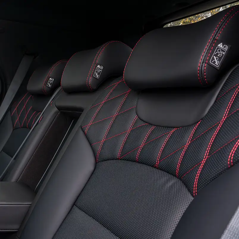 Premium leather seats with red stitching